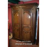 CONTINENTAL CHESTNUT ARMOIRE WITH TWO PANELLED DOORS ENCLOSING HANGING SPACE, 230CM X 180CM