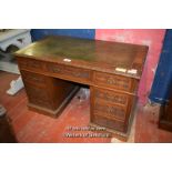 VICTORIAN CARVED OAK PEDESTAL DESK WITH INSET GREEN LEATHER TOP OVER NINE DRAWERS, 122CM