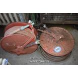 TWO VINTAGE FIRE HOSES AND REELS