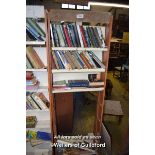 SHELVING UNIT CONTAINING A LARGE SELECTION OF MIXED PAPERBACK BOOKS