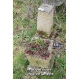 COMPOSITION STONE PLANTER ON PLINTH