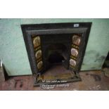 DECORATIVE CAST IRON FIRE INSERT WITH FLORAL TILES AND CAST FIRE FENDER