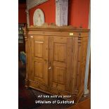 LARGE PINE CUPBOARD WITH PANELLED DOORS ENCLOSING HANGING SPACE, 188CM X 164CM