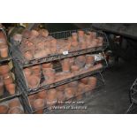 THREE METAL SHELVING UNITS COMPLETE WITH A LARGE QUANTITY OF TERRACOTTA PLANT POTS