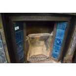 DECORATIVE CAST IRON FIRE INSERT WITH BLUE TILES