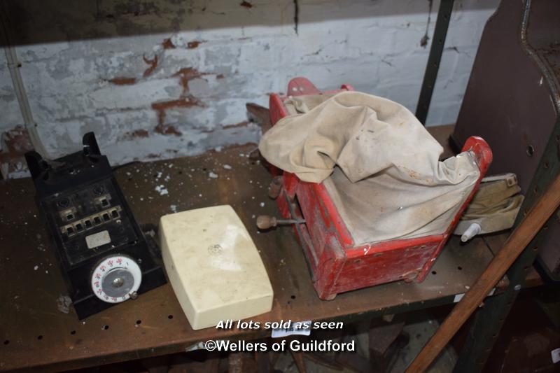 SHELF OF MIXED ITEMS INCLUDING A SEED SOWER