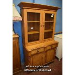 PINE CABINET WITH GLAZED DOORS OVER TWO DRAWERS AND CUPBOARDS BELOW, 112CM WIDE