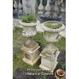 PAIR OF COMPOSITITON STONE URNS WITH GRAPE AND VINE DETAIL ON PLINTHS EACH 96CM HIGH EACH