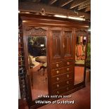 EDWARDIAN WALNUT TRIPLE WARDROBE WITH CENTRAL PANELLED DOORS ENCLOSING SHELVES, FLANKED BY