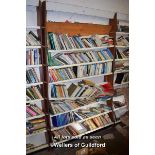 SHELVING UNIT CONTAINING A LARGE SELECTION OF MIXED PAPERBACK BOOKS