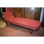 VICTORIAN MAHOGANY FRAMED CHAISE LONGUE WITH BUTTONED RED UPHOLSTERY ON TURNED LEGS