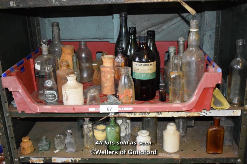 TWO SHELVES OF BOTTLES AND JARS