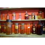 TWO SHELVES OF APOTHACARY JARS