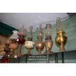 SHELF TOP OF EIGHT MIXED OIL LAMPS