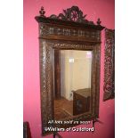 VICTORIAN OAK WALL MIRROR WITH FIGURAL SURMOUNT AND CHIP CARVED BORDERS, 153CM X 117CM (1872)