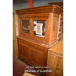 19TH CENTURY CONTINENTAL OAK CABINET WITH TWO GLAZED DOORS OVER AN OPEN SHELF WITH DRAWERS AND