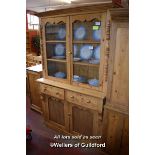 PINE DRESSER WITH GLAZED TOP DOORS OVER TWO DRAWERS WITH CUPBOARDS BELOW, 127CM WIDE