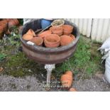 QUARTER BARREL PLANTER ON CAST IRON BASE