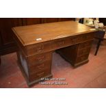 LATE VICTORIAN OAK PEDESTAL DESK WITH NINE DRAWERS AND COOPER HANDLES, 137CM X 70CM