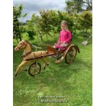 *AN EARLY AMERICAN CHILDS PEDAL HORSE AND TRAP WITH TWO LEATHER HAND REINS