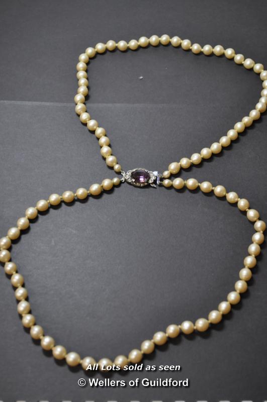 Double strand of simulated pearls, silver clasp inset with purple paste, stamped 'silver, Lotus', - Image 2 of 10