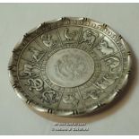 Chinese white metal zodiac dish with coin inset to the centre, marked 'Waikee 90 silver', 9.75cm