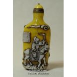 A Chinese yellow glass snuff bottle relief decorated with an equestrian figure.