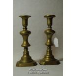 A pair of Victoria brass candlesticks