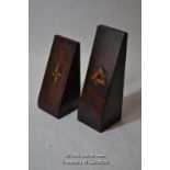 Two mahogany triangular bookends with Masonic motifs inlaid.