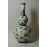 Chinese double gourd vase decorated with butterflies on pale background, 29.5cm.