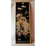 *An Indonesian batik depicting a dancing beast, 100 x 33cm.