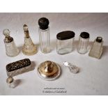 A group of cut glass dressing table bottles and jars, all with silver lids, various dates and