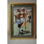 Football - Pele, a framed photo of football legend Pele with Bobby Moore, signed in pen by Pele,