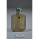 A small Chinese snuff bottle with green stone lid.