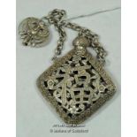 A Chinese white metal scent holder with suspension chain.