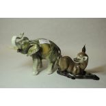 Royal Dux trumpeting elephant^ 15.5cm; small porcelain figure of a fawn. (2)