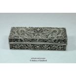 A Chinese rectangular white metal box decorated all over with dragons