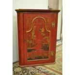 A chinoiserie decorated hanging corner cupboard with single door eclosing two shaped shelves, 87.