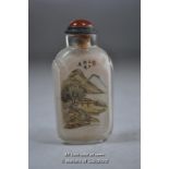 Chinese glass snuff bottle with interior paiting of mountain scenery.