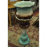 An Oxford jardiniere and stand^ the jardiniere has damage to the top rim^ the stand is in good