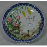 Chinese polychrome plate decorated with geese and plants, with inscription, 21cm diameter.