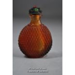 A Chinese amber glass snuff bottle.