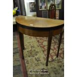 An Edwardian demi-lune mahogany card table with geometric satinwood inlay, 82 x 40cm.