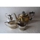 A three piece silver plated tea set and a similar cream jug.