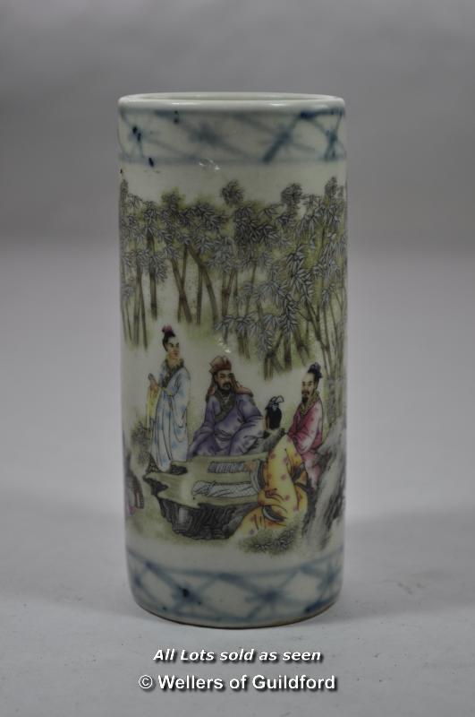 Chinese polychrome cylindrical brush pot decorated with figures in a garden, insciption, 12cm.