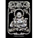 A Chinese white metal pendant of Buddha.