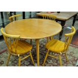 *Ercol dropleaf circular dining table and set of Ercol four stick back chairs