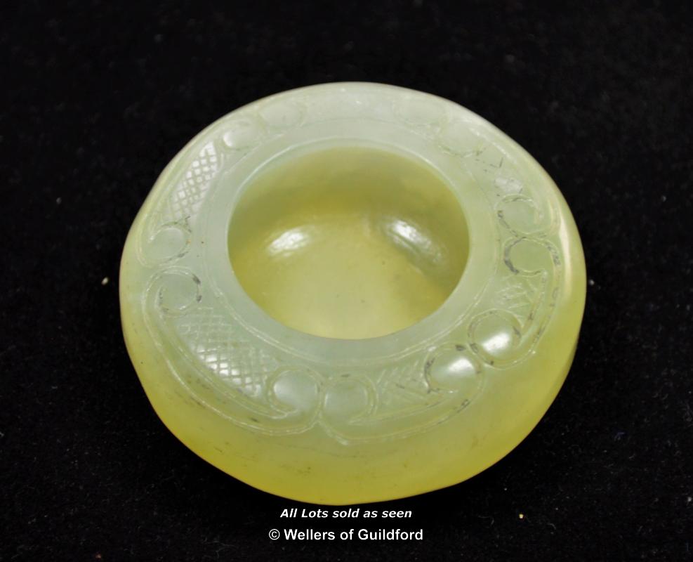 Chinese pale green hardstone circular water holder, 5.5cm diameter.