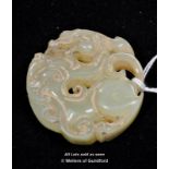 Chinese jade pendant carved as a dragon.