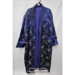 A mid 20th Century Chinese embroidered blue silk robe with collarl long sleeves and pockets.